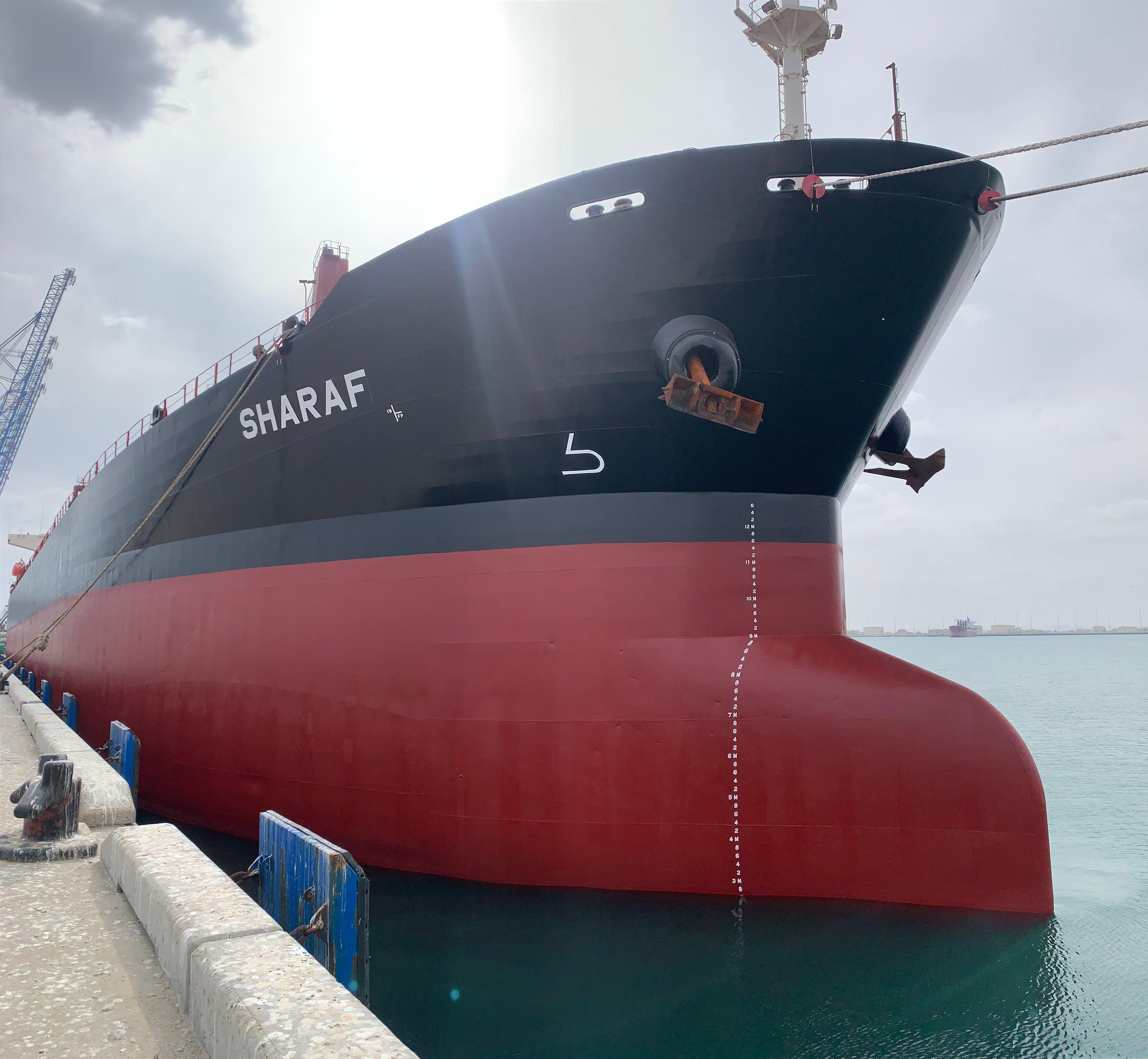 Bulk carrier MV SHARAF showing its bow and hull markings